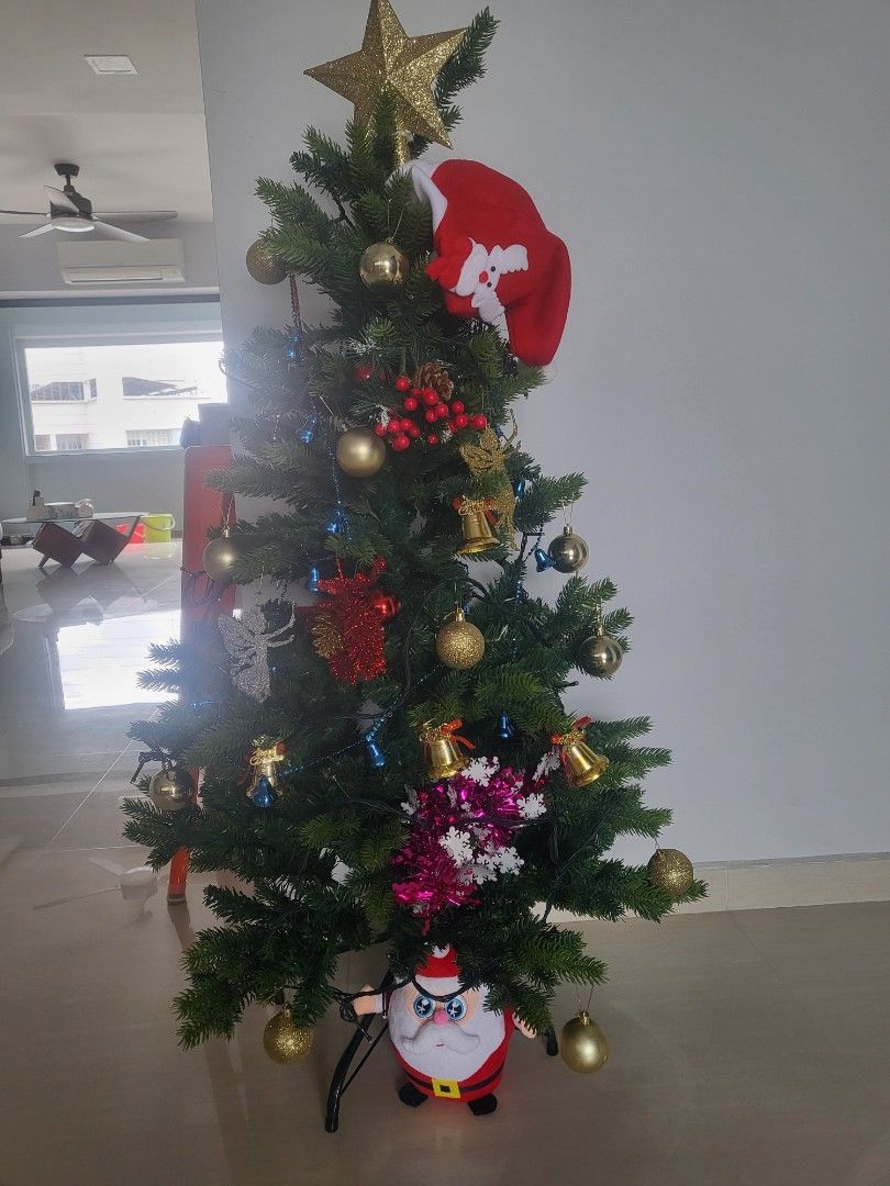 Artificial Christmas Tree (Category: Artificial Plants & Flowers) located in Singapore. Submitted by miki4487 (Listing ID 1337079708, Image 3). Description: All-in with decoratives n lights together with Santa X below. Only used 2x during each christmas. Height 42cm.