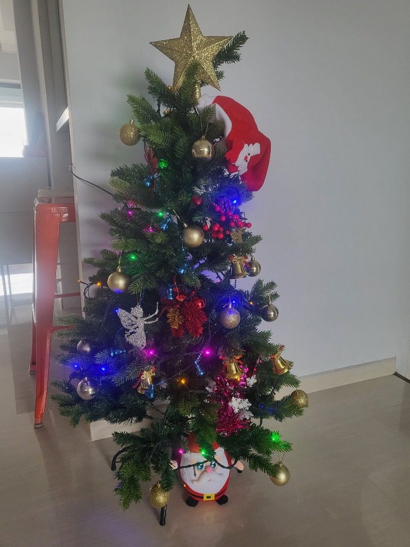 Artificial Christmas Tree (Category: Artificial Plants & Flowers) located in Singapore. Submitted by miki4487 (Listing ID 1337079708, Image 2). Description: All-in with decoratives n lights together with Santa X below. Only used 2x during each christmas. Height 42cm.