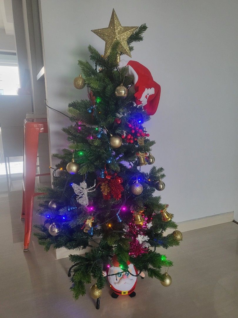 Artificial Christmas Tree (Category: Artificial Plants & Flowers) located in Singapore. Submitted by miki4487 (Listing ID 1337079708, Image 1). Description: All-in with decoratives n lights together with Santa X below. Only used 2x during each christmas. Height 42cm.