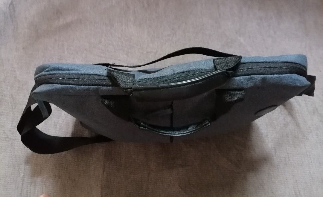 HP laptop bag (Category: Laptop Bags & Sleeves) located in Cagayan de Oro. Submitted by emma3782 (Listing ID 1337103153, Image 3). Description: In good condition No heavy flaws Dimensions: 11"h 15"w 2" base 3" handle 55" sling strap adjustable.