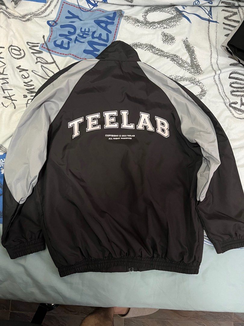 WindJacket Teelab Oversize Basic Logo Jacket (Category: Coats, Jackets and Outerwear) located in Singapore. Submitted by prawns123 (Listing ID 1337116424, Image 2). Description: Width 65cm Only used once during my overseas trip, not using anymore hence selling, as good as new!.