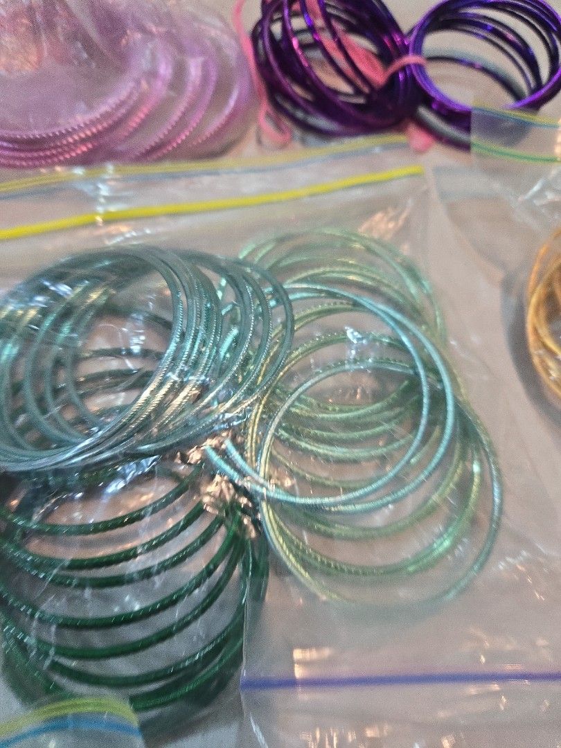 Bangles (Category: Bracelets) located in Singapore. Submitted by sumithakanthaguru (Listing ID 1334137938, Image 8). Description: many different colours size 28 aluminium bangles no glitter on all except one (orange set) red maroon royal blue light gold gold green mint green royal purple orange light purple pink silvery gold.
