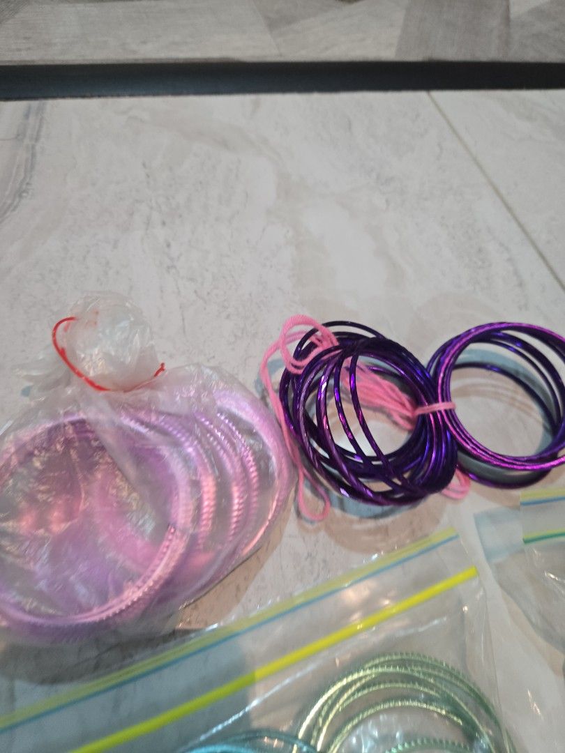 Bangles (Category: Bracelets) located in Singapore. Submitted by sumithakanthaguru (Listing ID 1334137938, Image 7). Description: many different colours size 28 aluminium bangles no glitter on all except one (orange set) red maroon royal blue light gold gold green mint green royal purple orange light purple pink silvery gold.