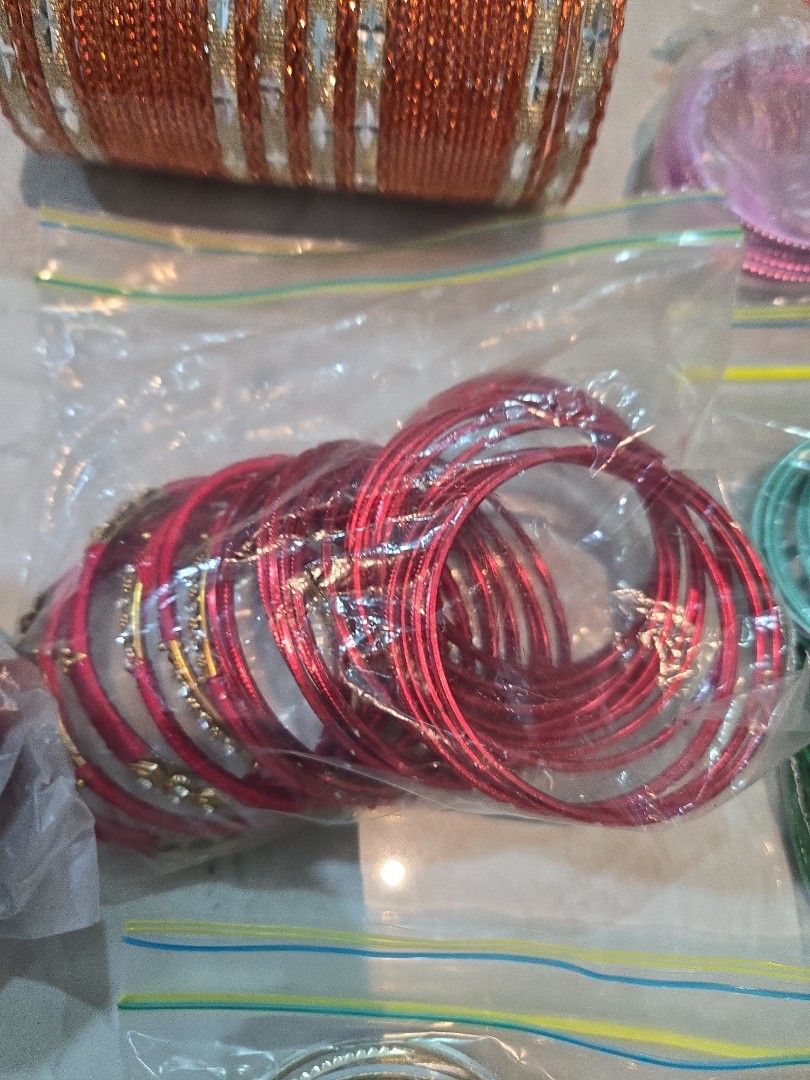 Bangles (Category: Bracelets) located in Singapore. Submitted by sumithakanthaguru (Listing ID 1334137938, Image 5). Description: many different colours size 28 aluminium bangles no glitter on all except one (orange set) red maroon royal blue light gold gold green mint green royal purple orange light purple pink silvery gold.
