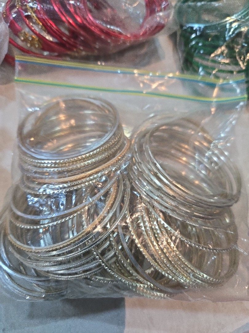 Bangles (Category: Bracelets) located in Singapore. Submitted by sumithakanthaguru (Listing ID 1334137938, Image 4). Description: many different colours size 28 aluminium bangles no glitter on all except one (orange set) red maroon royal blue light gold gold green mint green royal purple orange light purple pink silvery gold.