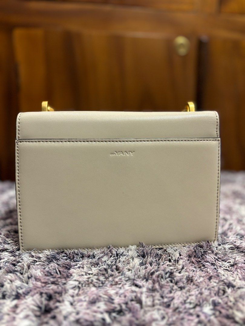 Oryany (Category: Luxury Bags & Wallets) located in Imus. Submitted by bagsofblessings24 (Listing ID 1334147904, Image 3). Description: Oryany kili/clutch leather bag Oryany is a luxury Korean brand Small size, light cream color Black wide strap Height 5.5 in x length 8 in Excellent condition Only flaw is the hairlines on the hardware ( pls see photo).