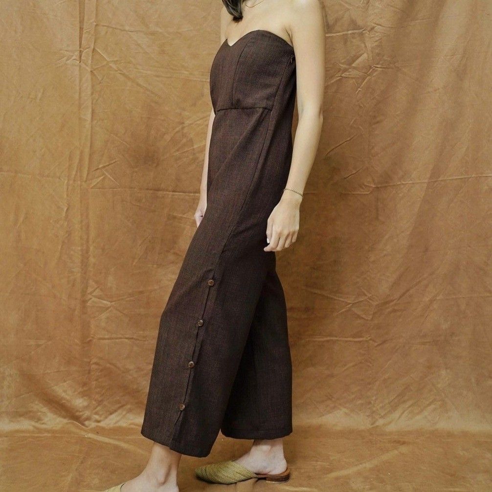 SOLANA Brown Jumpsuit (Category: Jumpsuits) located in Quezon City. Submitted by lexisstuff (Listing ID 1330432055, Image 1). Description: ⭐ PLEASE READ! ⭐ srp: php2700 fabric: textured size and fit: size xs, garterized bust, model is 5'1 bust 30 waist 25 hips 33, regular fit condition: 10/10 notes: pocket on one side, buttons on slits for the legs 🌼 shipping: metro manila 90 🌼 pay via BDO or GCash only 🌼 2-day reservation period 🌼 no returns