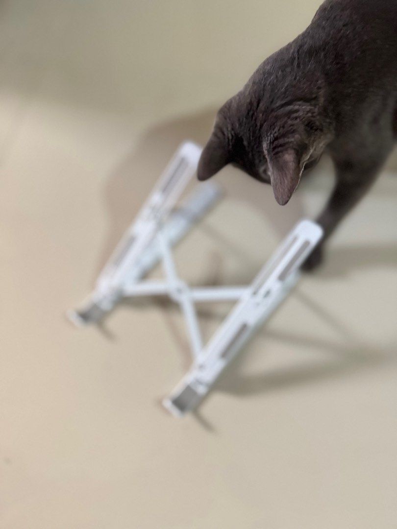white & gray foldable laptop stand (Category: Laptop Bags & Sleeves) located in Antipolo. Submitted by bananadeclutter (Listing ID 1334182118, Image 2). Description: cat is not included material: plastic.