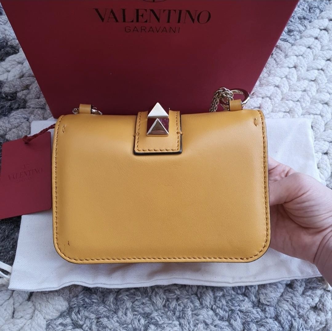 100% Authentic Valentino glam rock stud mini bag rockstud clutch (Category: Luxury Bags & Wallets) located in Las Pinas. Submitted by halo_muse (Listing ID 1337247378, Image 2). Description: 100% Authentic valentino glam rock mini bag Like new condition complete set (comes with box, dust bag, tag) same as picture.