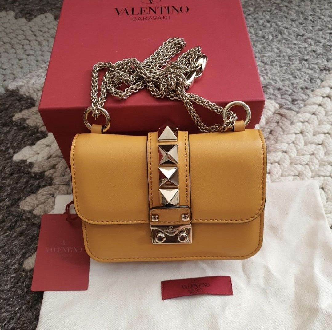 100% Authentic Valentino glam rock stud mini bag rockstud clutch (Category: Luxury Bags & Wallets) located in Las Pinas. Submitted by halo_muse (Listing ID 1337247378, Image 1). Description: 100% Authentic valentino glam rock mini bag Like new condition complete set (comes with box, dust bag, tag) same as picture.