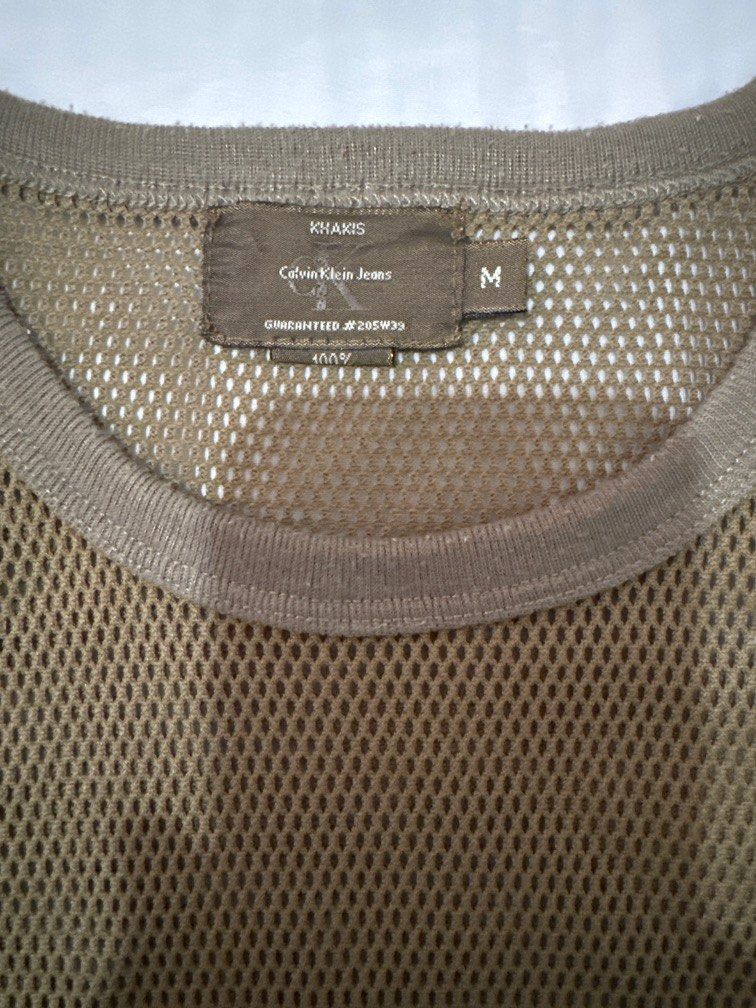 Calvin Klein vintage shirt medium (Category: Shirts) located in Quezon City. Submitted by rin.potato (Listing ID 1337411376, Image 2). Description: Original 90s Calvin Klein shirt. See through siya so you can wear black spaghetti strap inside. Shoulders 14in. Chest 17in. Length 19in. .
