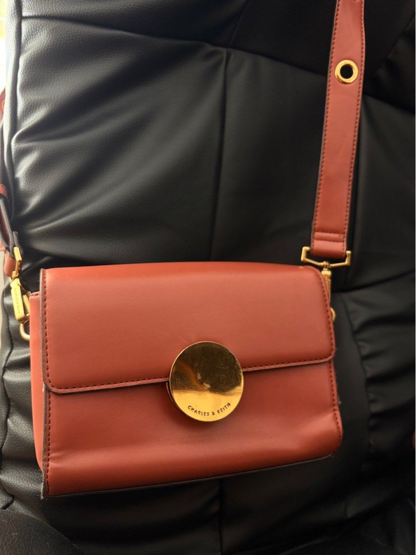 Charles & Keith Sling/Cross body bag (Category: Cross-body Bags) located in Rodriguez. Submitted by declutterwithshals. (Listing ID 1337271243, Image 3). Description: Condition: 8/10 Metallic accent push lock Flaws shawn in photos Rfs: No longer using it Note: actual color of the product may slightly vary from the color of this photo due to lighting .