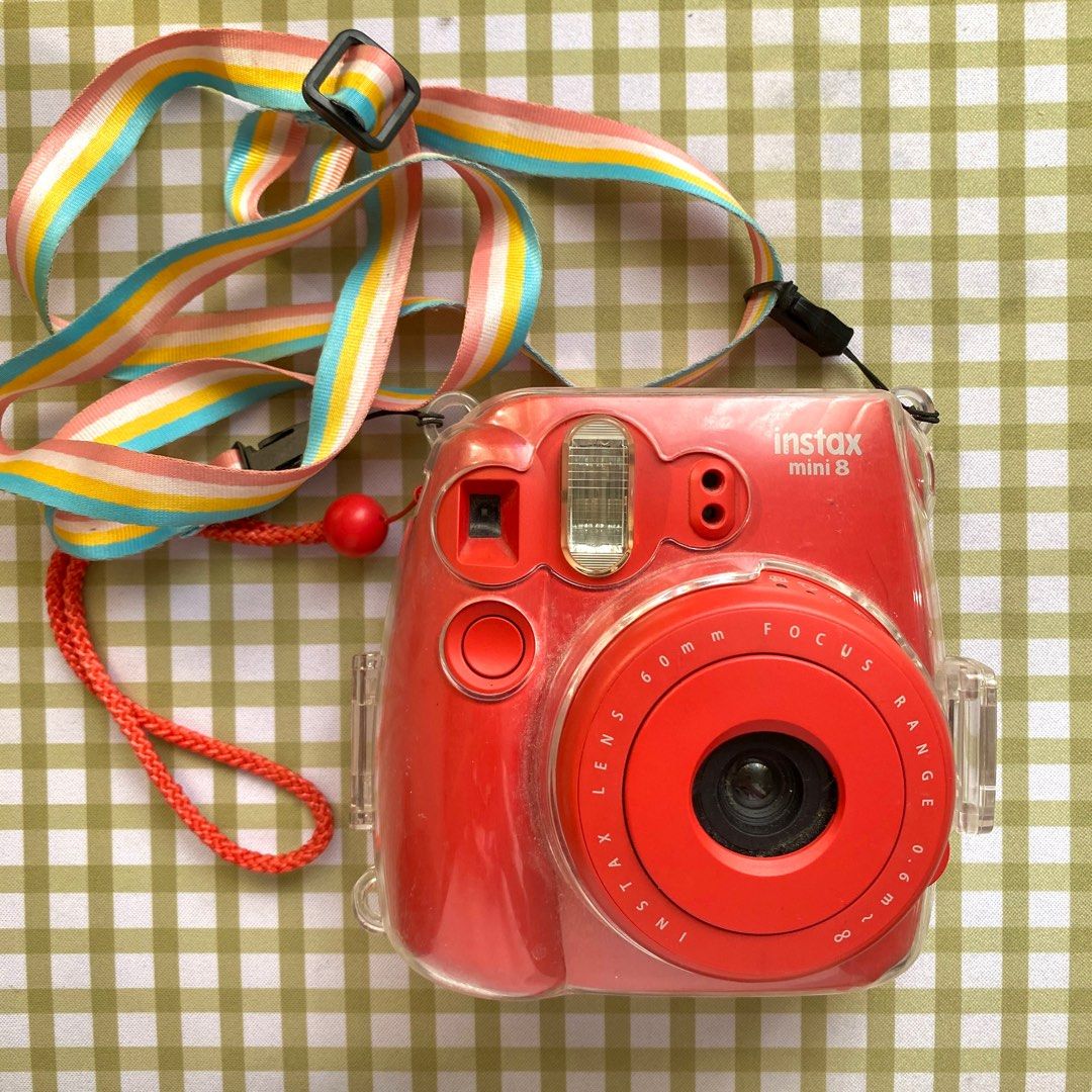 For Sale: Instax Mini 8 ! Read Description ! (Category: Cameras) located in Manila. Submitted by eygee. (Listing ID 1337306599, Image 2). Description: Selling my Fujifilm Instax Mini 8 in Red Condition: The camera produces dark outputs, likely due to something partially blocking the lens. This seems to require manual adjustment of the lens before taking pictures, and it does work after adjusting. I recently realized this issue when someone shared