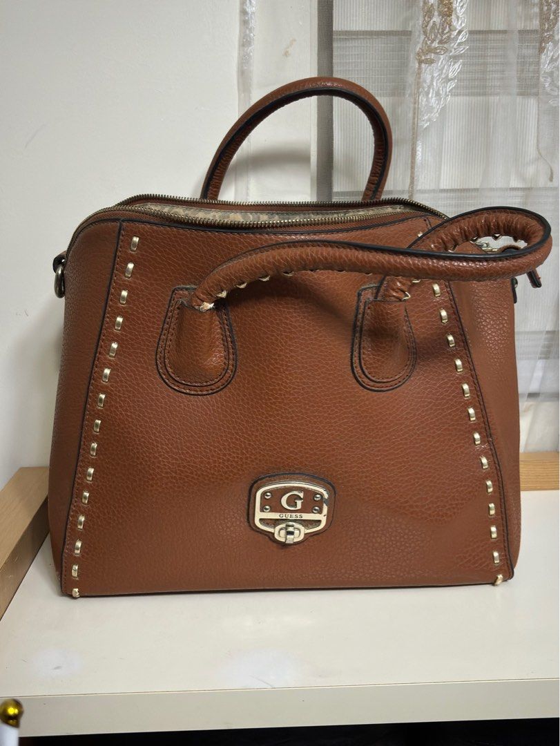 Guess Brown Handbag (Category: Shoulder Bags) located in Taguig. Submitted by johns_stuff (Listing ID 1337288273, Image 1). Description: Moderately big handbag .