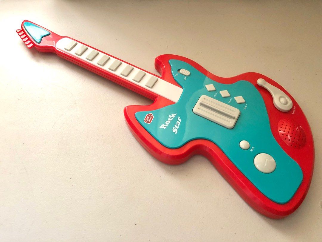 Rock Star Electronic Toy Guitar (Category: Musical Instruments) located in Imus. Submitted by dyelinn (Listing ID 1337382291, Image 1). Description: Electronic Toy Guitar ✨working✨ 📝has big buttons and controls that are perfect for little hands as they develop their fine motor skills. It features 8 musical notes, 3 rhythm sound effects, 8 demo songs and a demo key to listen to all the songs Brand: Chad Valley/ Argos Age: 3 years+ Flaws: Scratche