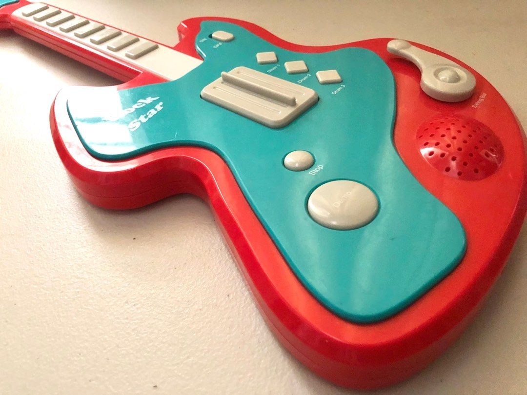 Rock Star Electronic Toy Guitar (Category: Musical Instruments) located in Imus. Submitted by dyelinn (Listing ID 1337382291, Image 2). Description: Electronic Toy Guitar ✨working✨ 📝has big buttons and controls that are perfect for little hands as they develop their fine motor skills. It features 8 musical notes, 3 rhythm sound effects, 8 demo songs and a demo key to listen to all the songs Brand: Chad Valley/ Argos Age: 3 years+ Flaws: Scratche