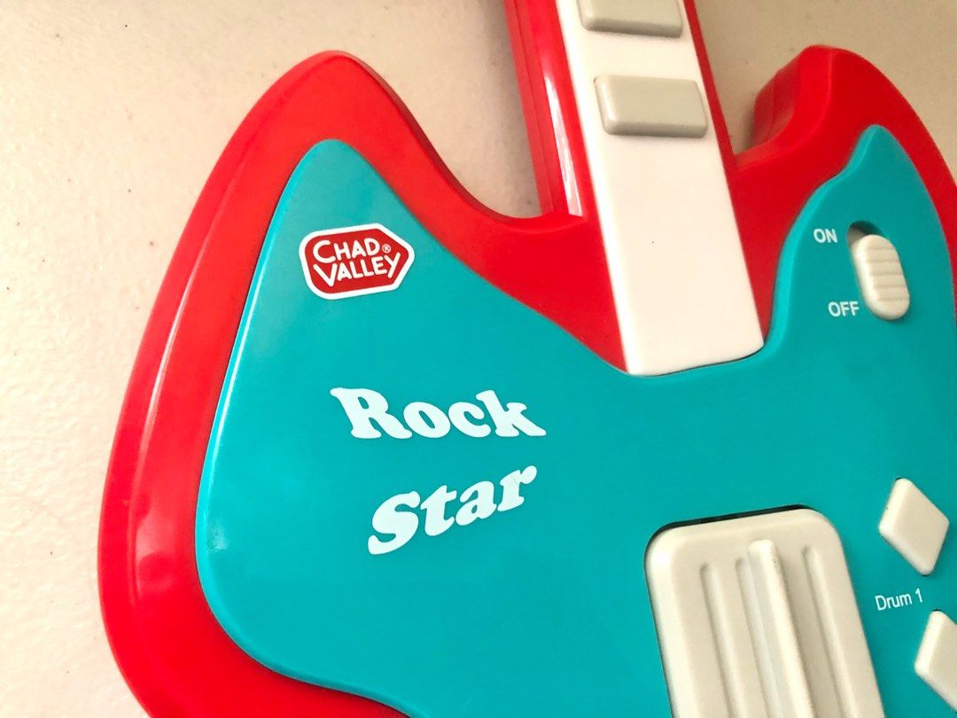 Rock Star Electronic Toy Guitar (Category: Musical Instruments) located in Imus. Submitted by dyelinn (Listing ID 1337382291, Image 3). Description: Electronic Toy Guitar ✨working✨ 📝has big buttons and controls that are perfect for little hands as they develop their fine motor skills. It features 8 musical notes, 3 rhythm sound effects, 8 demo songs and a demo key to listen to all the songs Brand: Chad Valley/ Argos Age: 3 years+ Flaws: Scratche