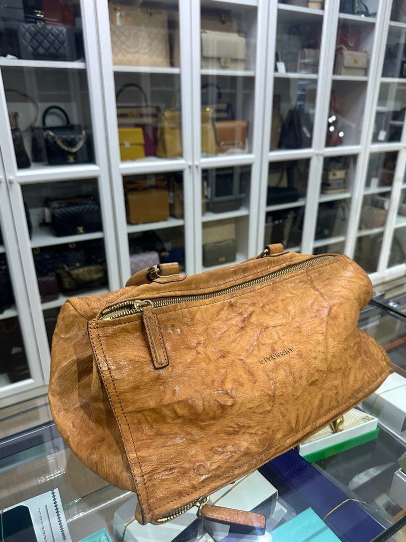 Givenchy Large Pandora Brown Bag in Sheep Leather (Category: Luxury Bags & Wallets) located in Taguig. Submitted by closetcompany (Listing ID 1337545627, Image 2). Description: Givenchy Large Pandora Brown Bag in Sheep Leather 🫧Php 35,500 🫧CONDITION: Fair condition with signs of usage. Rubs and small cracks on the sides and corners, darkening and creasing on the top handle, mild oxidation on the hardwares, small pen mark on the front, dirt mark