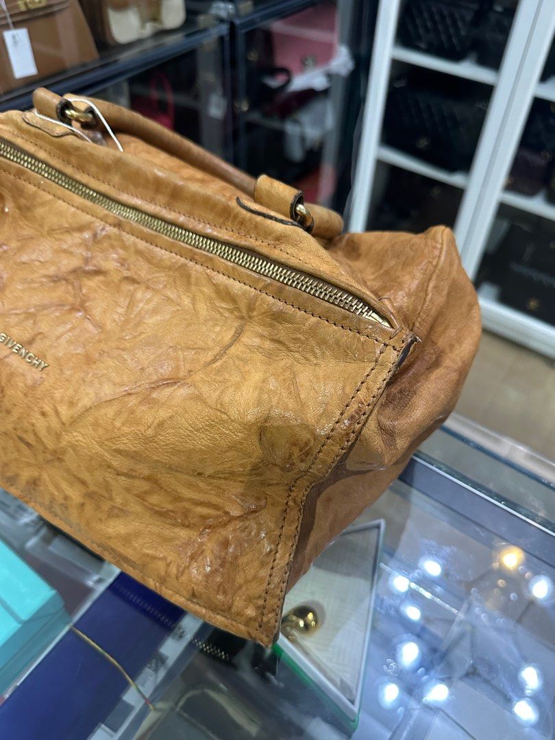 Givenchy Large Pandora Brown Bag in Sheep Leather (Category: Luxury Bags & Wallets) located in Taguig. Submitted by closetcompany (Listing ID 1337545627, Image 3). Description: Givenchy Large Pandora Brown Bag in Sheep Leather 🫧Php 35,500 🫧CONDITION: Fair condition with signs of usage. Rubs and small cracks on the sides and corners, darkening and creasing on the top handle, mild oxidation on the hardwares, small pen mark on the front, dirt mark