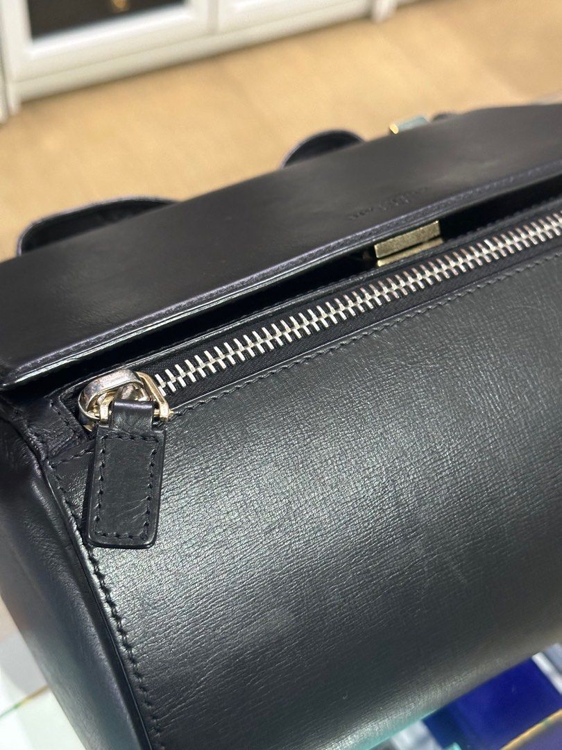 Givenchy Pandora Box Medium in Black Calfskin Leather (Category: Luxury Bags & Wallets) located in Taguig. Submitted by closetcompany (Listing ID 1337582795, Image 2). Description: Givenchy Pandora Box Medium in Black Calfskin Leather 🫧Php 39,500 🫧CONDITION: Good condition with signs of usage. rubs on the corners, creasing and glazing wear on the strap and leather, scratch marks on some part of the leather, and oxidation on the hardwares. 🫧RAT