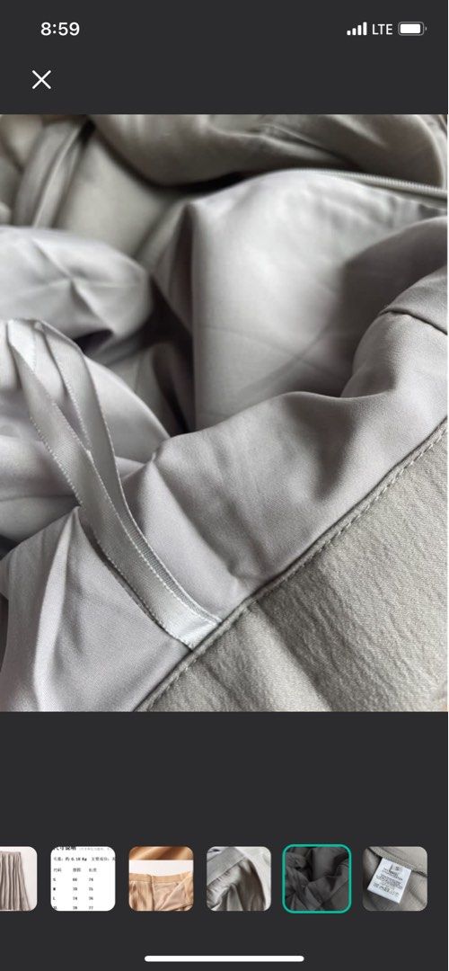 Grey Tencel A Line Skirt (Category: Skirts) located in Singapore. Submitted by lacedtsme (Listing ID 1337417508, Image 3). Description: Colour is exact to the close up photos V cool skirt to wear in hotter weathers .