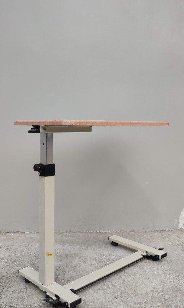 hydraulic bed side table pull out table (Category: Tables & Sets) located in Valenzuela. Submitted by jmalano (Listing ID 1337574410, Image 2). Description: max Height 96cm. standard height 65cm. Length 76cm. Width 38cm. used hydraulic table with wheels in good condition with minimal scratches. can be used as coffee table, bedside table, study table. pick up location Valenzuela City.