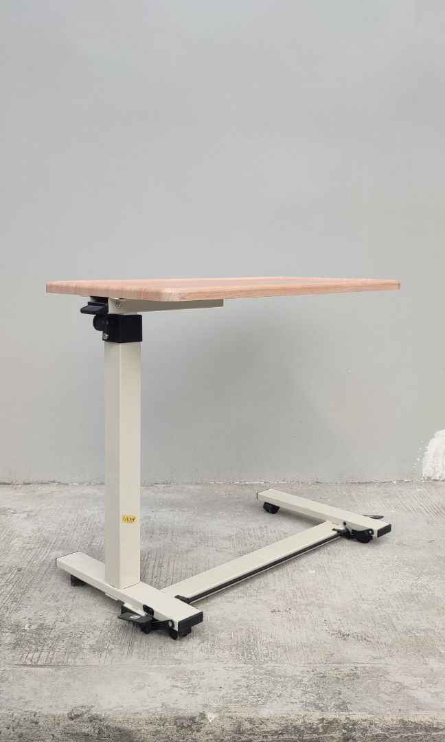 hydraulic bed side table pull out table (Category: Tables & Sets) located in Valenzuela. Submitted by jmalano (Listing ID 1337574410, Image 1). Description: max Height 96cm. standard height 65cm. Length 76cm. Width 38cm. used hydraulic table with wheels in good condition with minimal scratches. can be used as coffee table, bedside table, study table. pick up location Valenzuela City.