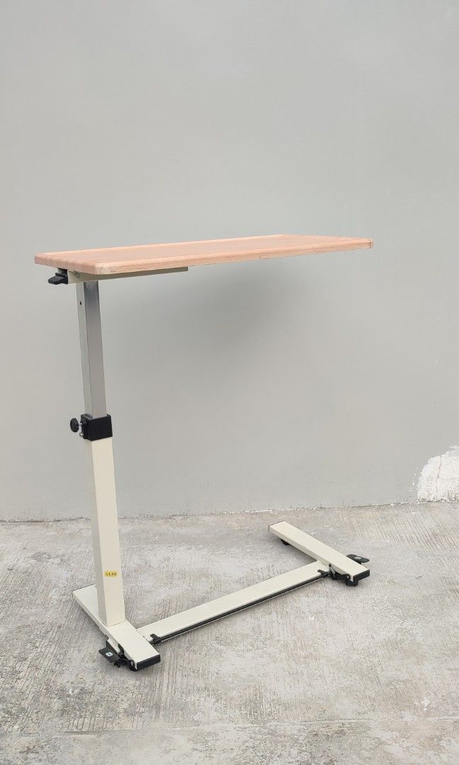 hydraulic bed side table pull out table (Category: Tables & Sets) located in Valenzuela. Submitted by jmalano (Listing ID 1337574410, Image 3). Description: max Height 96cm. standard height 65cm. Length 76cm. Width 38cm. used hydraulic table with wheels in good condition with minimal scratches. can be used as coffee table, bedside table, study table. pick up location Valenzuela City.