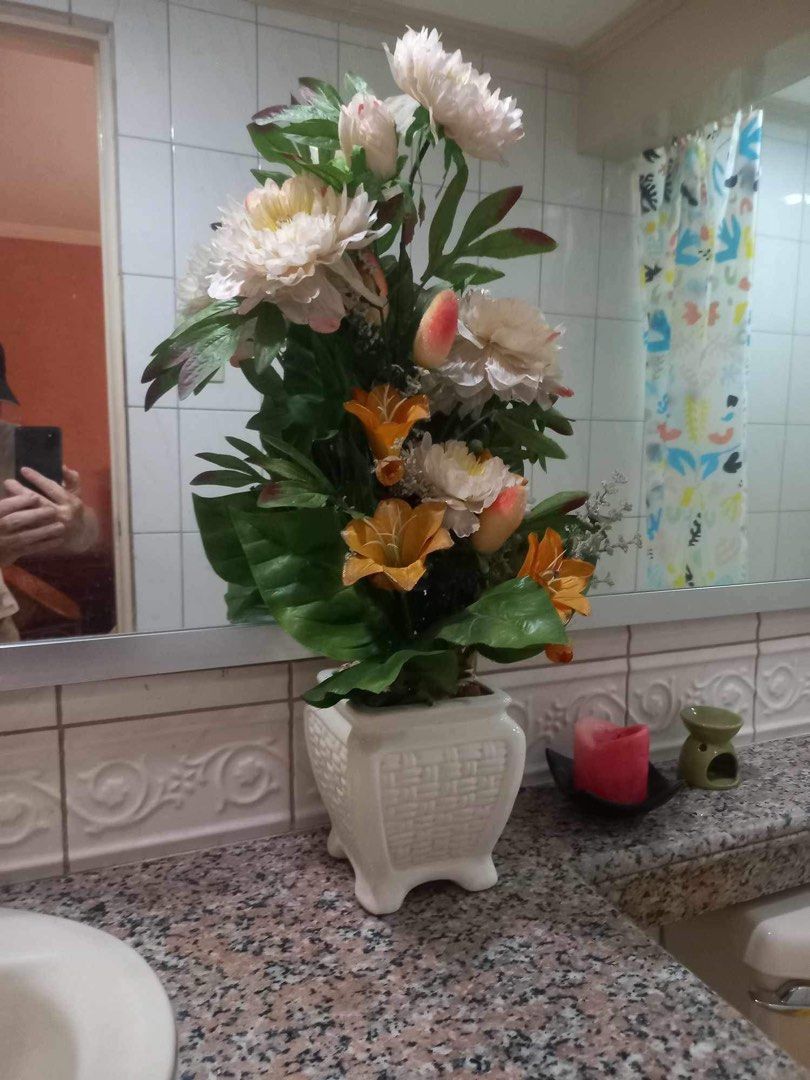 White and Orange Artificial Flowers in White Pot (Category: Artificial Plants & Flowers) located in Taguig. Submitted by tishatrish (Listing ID 1337519357, Image 1). Description: 28in H.