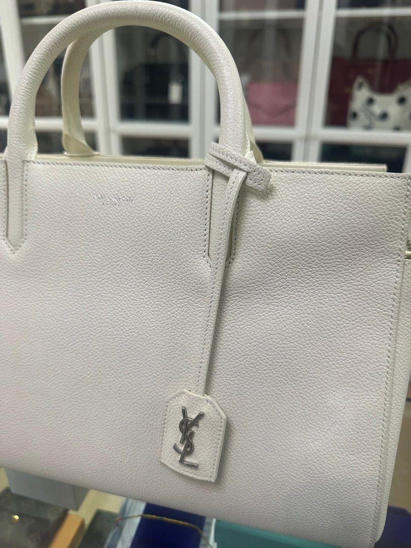 YSL Cabas Rive Gauche Medium Navy Leather Satchel (Category: Luxury Bags & Wallets) located in Taguig. Submitted by closetcompany (Listing ID 1337541524, Image 3). Description: YSL Cabas Rive Gauche Medium Navy Leather Satchel 🫧Php 60,000 🫧CONDITION: Very Good condition with usual signs of usage. Minor discoloration on some parts of the leather, adhesive stain on side, handles, and some parts of the leather trim & interior, and hairline scratch