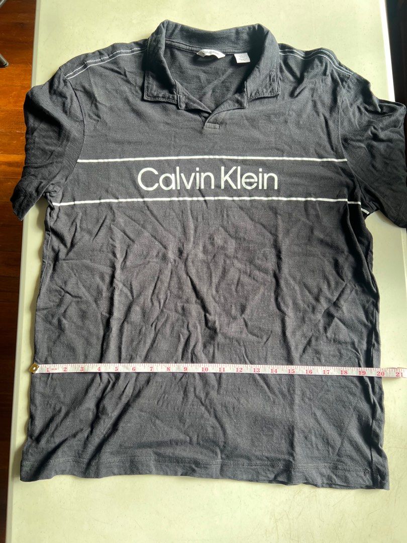 Calvin Klein Polo (Category: Tshirts & Polo Shirts ) located in Paranaque City. Submitted by raphaels_things (Listing ID 1337658627, Image 2). Description: Black Open/No-Button Polo Meetups can be arranged near BF Homes. Shipping fee is care of buyer..