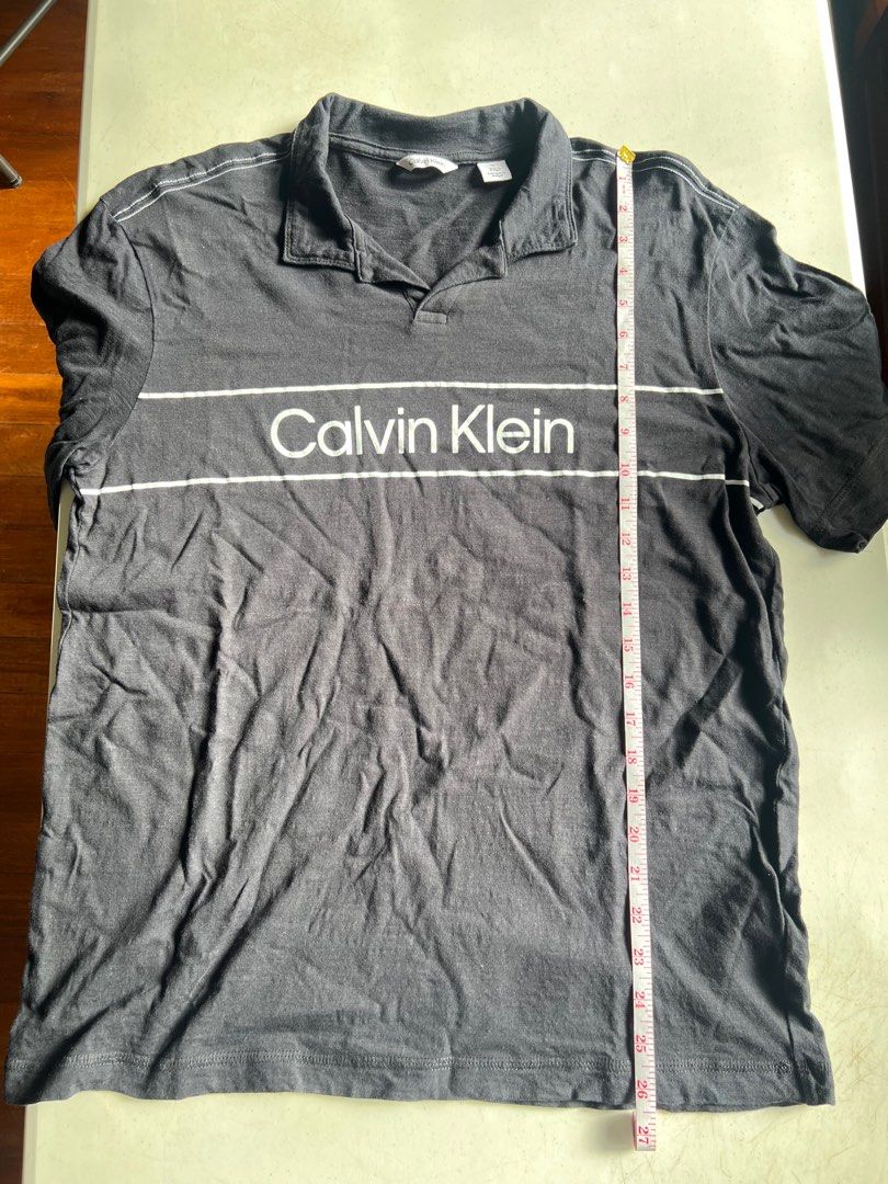 Calvin Klein Polo (Category: Tshirts & Polo Shirts ) located in Paranaque City. Submitted by raphaels_things (Listing ID 1337658627, Image 1). Description: Black Open/No-Button Polo Meetups can be arranged near BF Homes. Shipping fee is care of buyer..