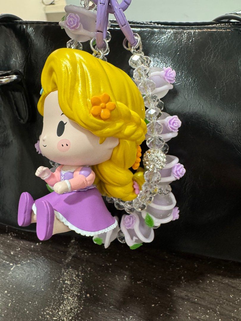 Rapunzel Popmart Charm (Category: Designer & Blind Box Toys) located in Taytay. Submitted by yamsulitdmd (Listing ID 1337617592, Image 3). Description: Authentic popmart figure. Comes with original box and accessories. Can be used as phone or bag charm. .