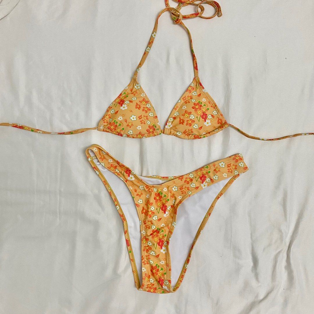 Shein orange floral bikini swimsuit (Category: Bikinis & Swimsuits) located in Mandaluyong City. Submitted by fuhtile (Listing ID 1337745139, Image 1). Description: Barely used.