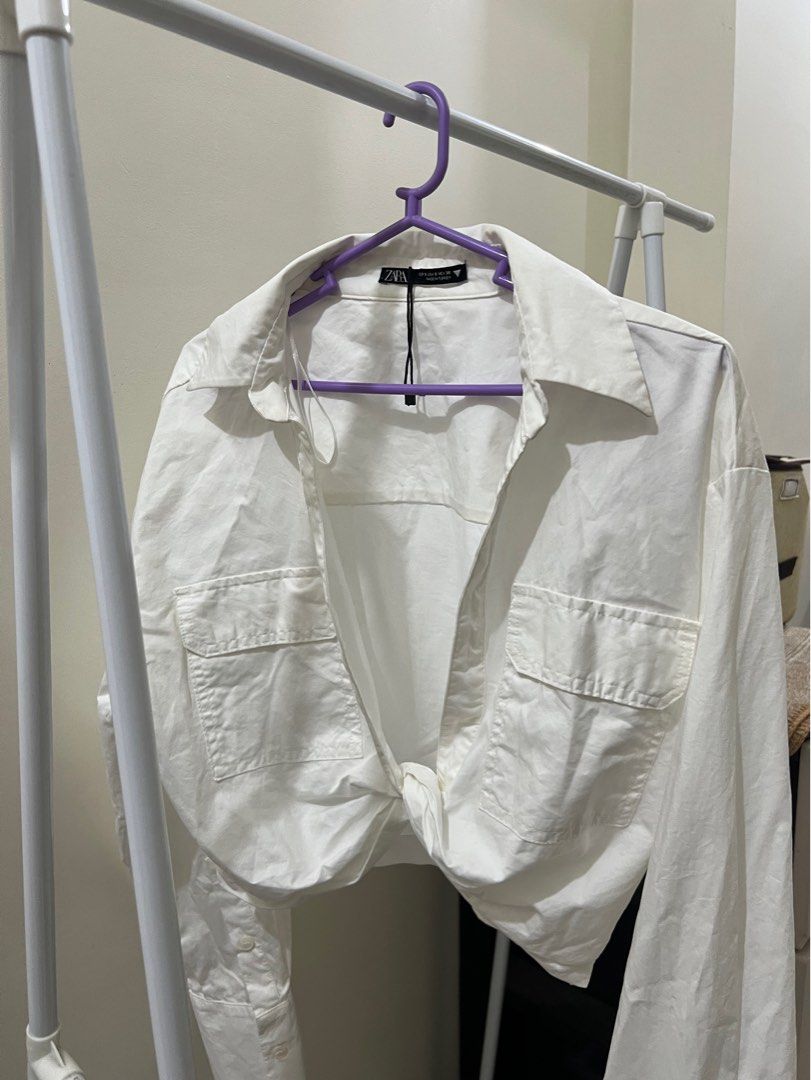 ZARA front twist white shirt (Category: Blouses) located in Manila. Submitted by wardrobeaddict28 (Listing ID 1337749494, Image 2). Description: .