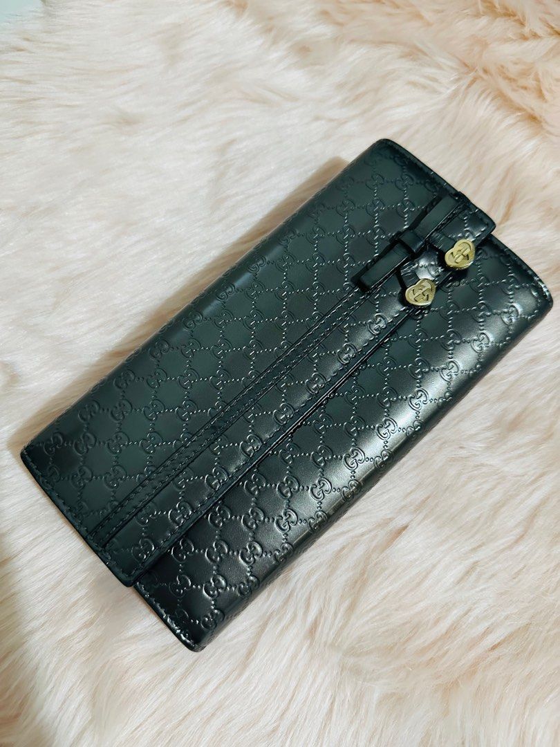 Auth Patent Gucci Micro Gucciss Bow Heart Wallet (Category: Luxury Bags & Wallets) located in Porac. Submitted by bagitupshopph (Listing ID 1337823683, Image 3). Description: Authentic Patent Gucci Micro Gucciss Bow Heart Wallet Crafted with Gucci Micro GG monogram embossed patent in glossy gunmetal with bow heart embellishment In very good condition Comes with dustbag, box, card.