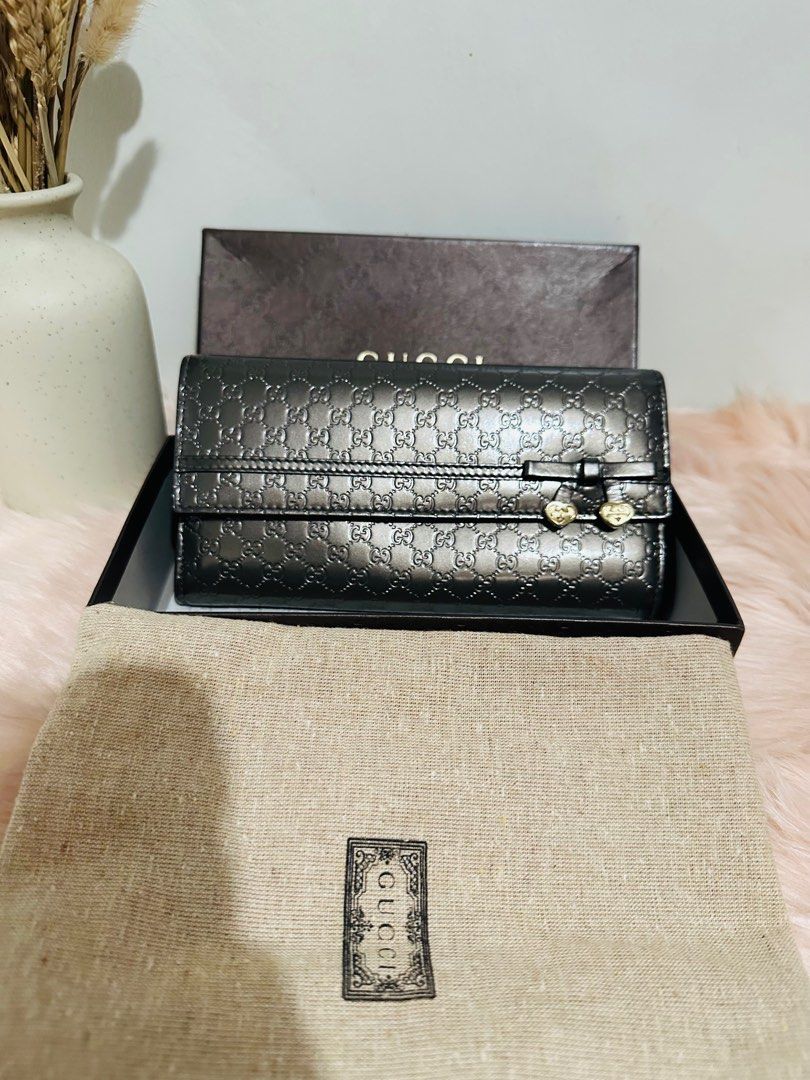 Auth Patent Gucci Micro Gucciss Bow Heart Wallet (Category: Luxury Bags & Wallets) located in Porac. Submitted by bagitupshopph (Listing ID 1337823683, Image 2). Description: Authentic Patent Gucci Micro Gucciss Bow Heart Wallet Crafted with Gucci Micro GG monogram embossed patent in glossy gunmetal with bow heart embellishment In very good condition Comes with dustbag, box, card.