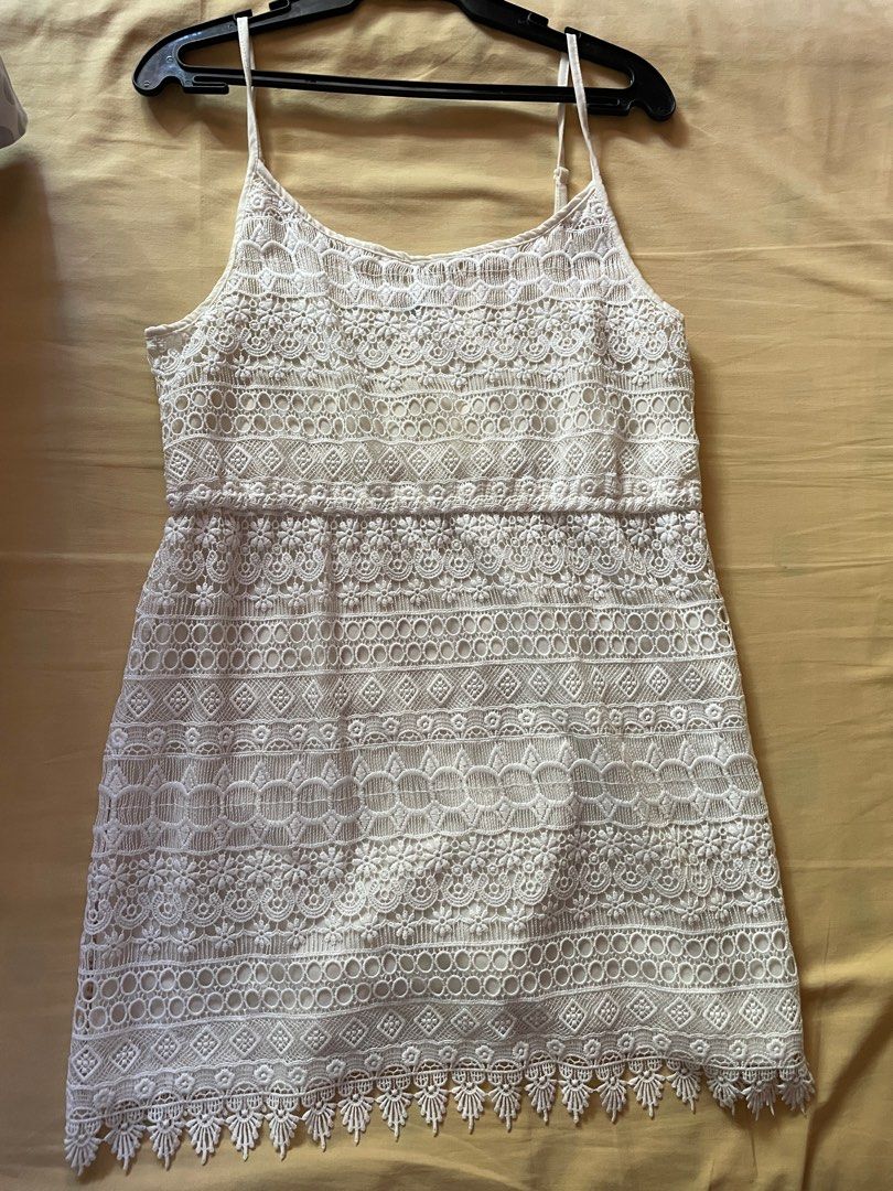 White Lace Crochet Short Dress (Category: Dresses) located in Quezon City. Submitted by iaaaa29 (Listing ID 1337807439, Image 1). Description: With adjustable straps.
