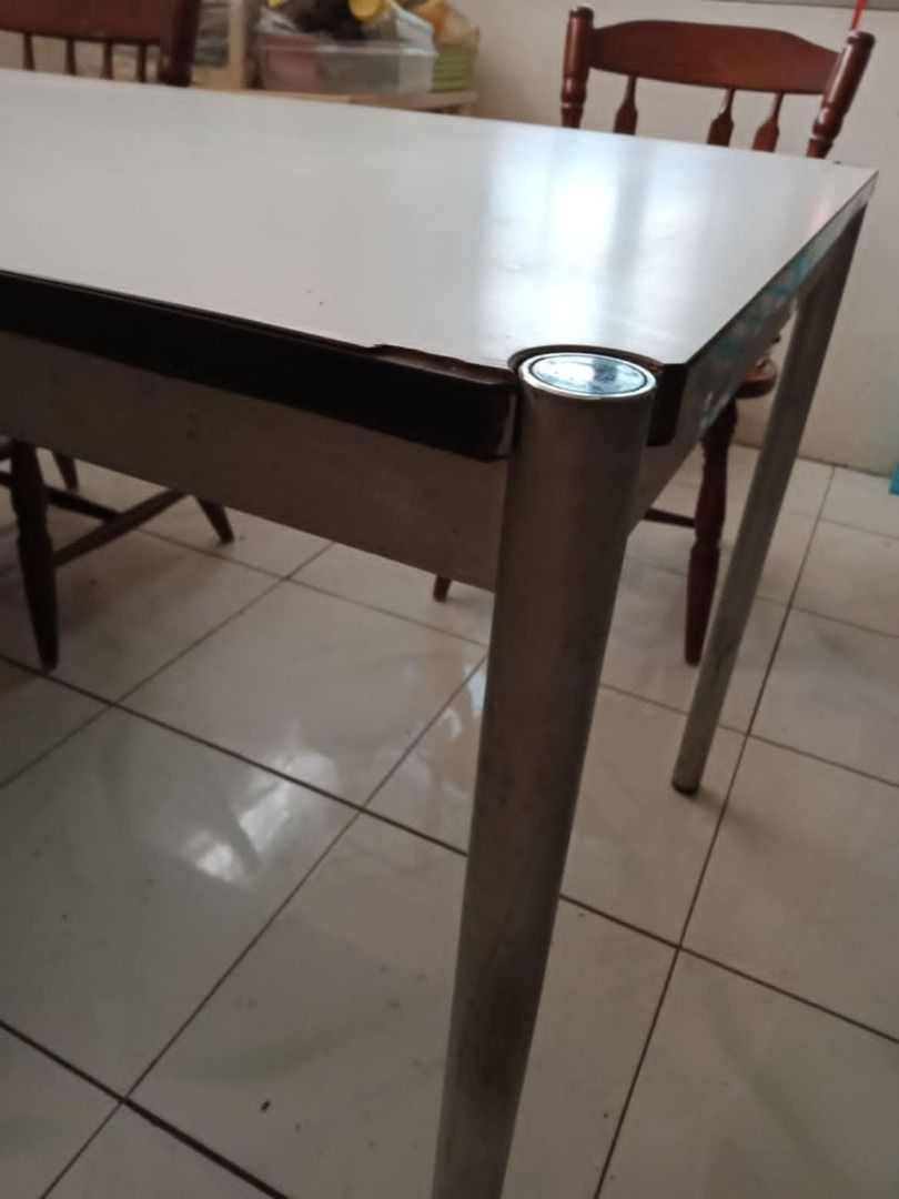 Dining Table (Category: Tables & Sets) located in Manila. Submitted by cristev.cristev (Listing ID 1337772977, Image 2). Description: Dining table, wooden, 6-seater,metal frame, heavy duty Dimensions are 59.75" long x 29.75" wide x 29" high.
