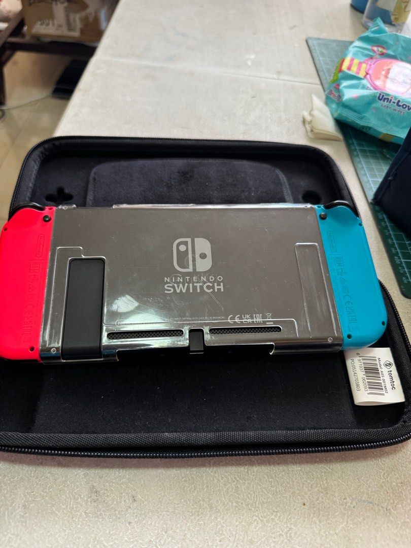 Nintendo Switch Ver.2 (Category: Nintendo) located in Pasig City. Submitted by crisbern23 (Listing ID 1337790776, Image 2). Description: Complete set with box Hardcase Additional Type C charger Physical Game- Just Dance 2019 Digital Game- Animal Crossing- New Horizon .