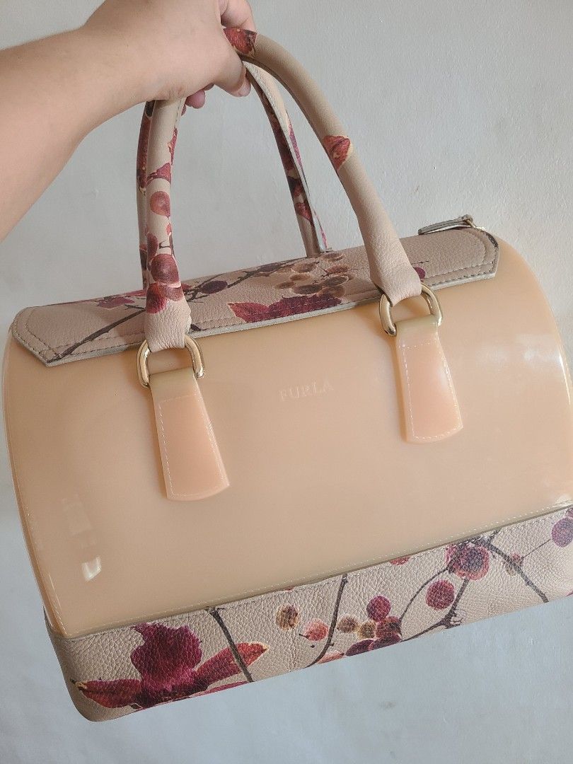 RARE Furla Candy Blossom Bag (Category: Luxury Bags & Wallets) located in Las Pinas. Submitted by prelovedbymharia (Listing ID 1337754866, Image 3). Description: This is a limited edition collection from Furla in 2011. It is considered a hard-to-find collection on the market. I'm selling it at a very low price because I need funds, but the price is still negotiable. The bag has only one minor flaw, which you can see in the last picture..