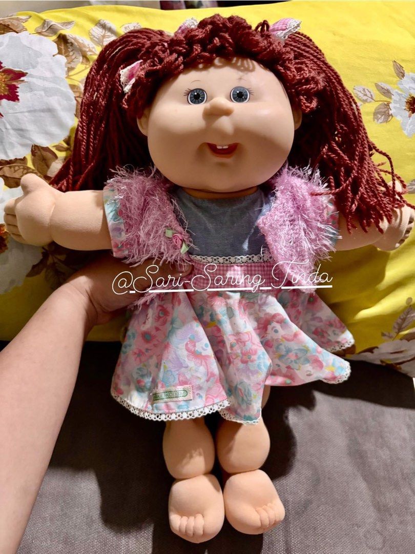 Vintage Cabbage Patch Kids Doll 1978/2004 Play Along (Category: Babies & Kids Fashion) located in Taytay. Submitted by michidc (Listing ID 1337756460, Image 1). Description: Vintage Cabbage Patch Kids 1978 /2004 Play along 9/10 condition ‼️Rare find‼️ ❤️7500 only❤️ Stock: 1 Would make a good addition to your collection🥰 Details: Pink/blue dress Brown yarn hair With serial number intact Clean Like new Lost paper tag Payments: BDO Deliveries: Grab