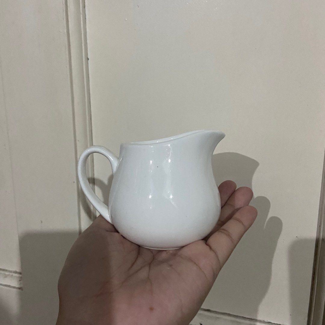 White Ceramic Creamer Pitcher (Category: Coffee & Tea Tableware) located in Taguig. Submitted by nessyyy (Listing ID 1337876623, Image 2). Description: Japan Surplus -75 each (120 pesos for two) Mode of Delivery: Lalamove or JnT only Mode of Payment: Gcash only.