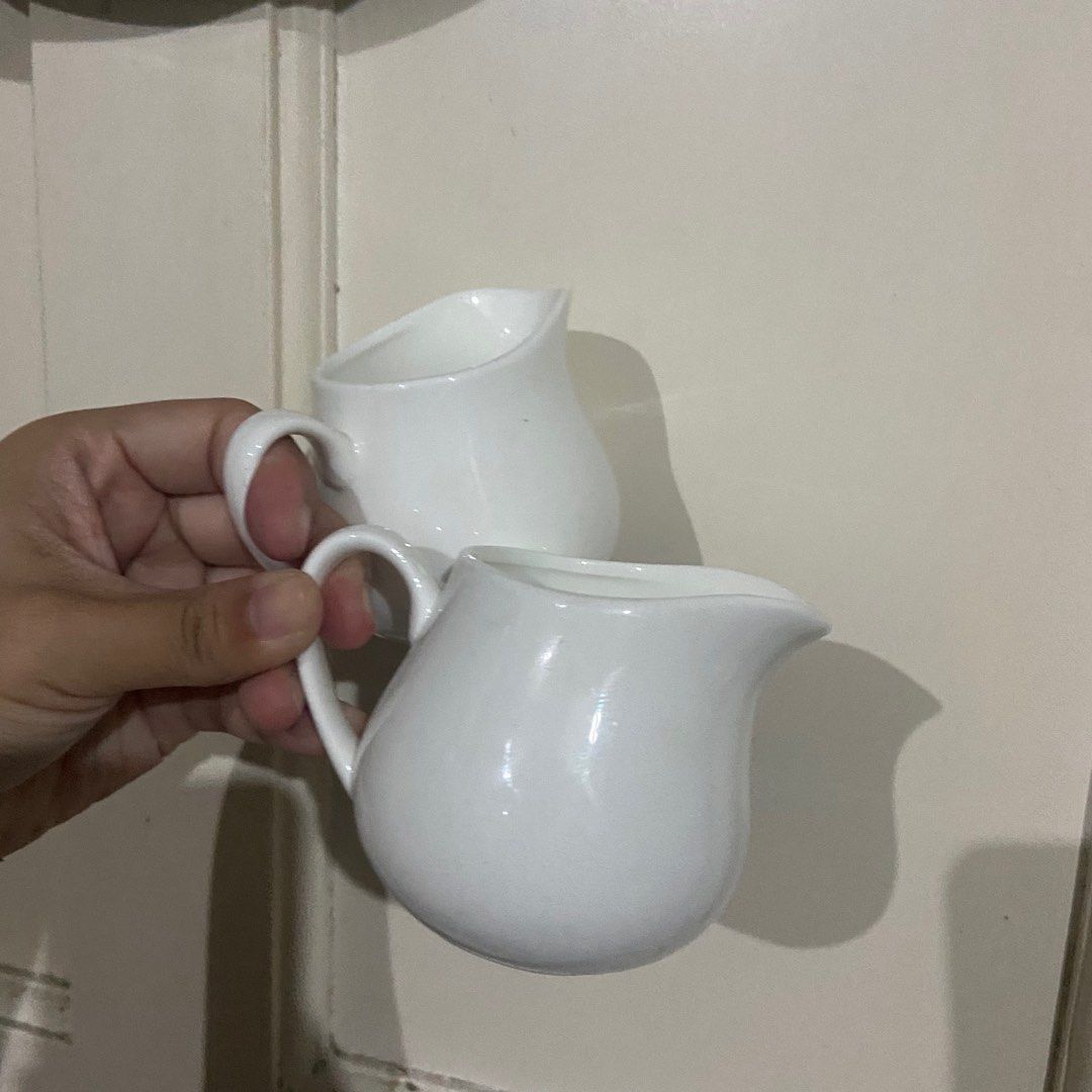 White Ceramic Creamer Pitcher (Category: Coffee & Tea Tableware) located in Taguig. Submitted by nessyyy (Listing ID 1337876623, Image 1). Description: Japan Surplus -75 each (120 pesos for two) Mode of Delivery: Lalamove or JnT only Mode of Payment: Gcash only.