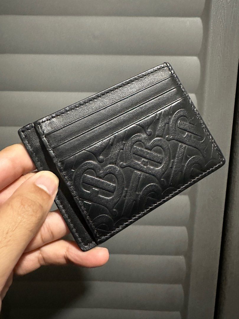 Burberry Black Monogram Bernie Card Holder (Category: Luxury Bags & Wallets) located in Quezon City. Submitted by dpkuno (Listing ID 1338065348, Image 1). Description: Personally used May scratch sa bottom part see last pic Interested? PM is the 🔑. Pagusapan natin Grained calfskin card holder in black. Embossed logo pattern at front and back faces. Six card slots and three note slots. Tonal textile lining. Approx. 4.25 length x 3.25 height..