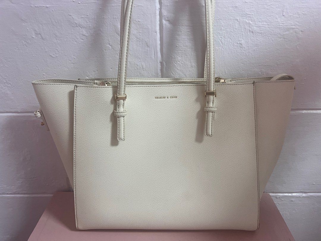 Charles and Keith Sansa Tote Bag (Category: Luxury Bags & Wallets) located in Quezon City. Submitted by mahliknvrr (Listing ID 1337941476, Image 2). Description: authentic charles and keith bag in cream white original price is 4,999 has minimal stains (as shown in the picture) slighty negotiable .