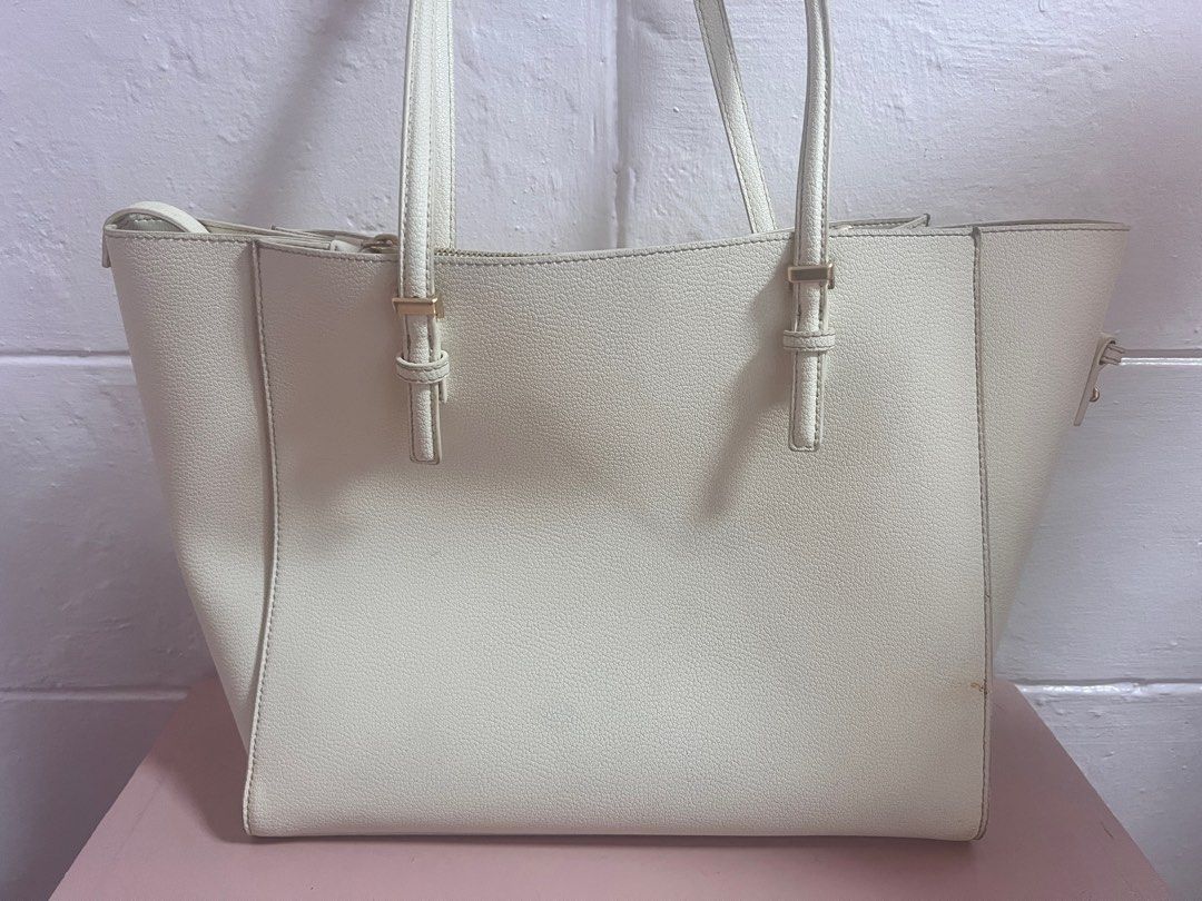 Charles and Keith Sansa Tote Bag (Category: Luxury Bags & Wallets) located in Quezon City. Submitted by mahliknvrr (Listing ID 1337941476, Image 3). Description: authentic charles and keith bag in cream white original price is 4,999 has minimal stains (as shown in the picture) slighty negotiable .