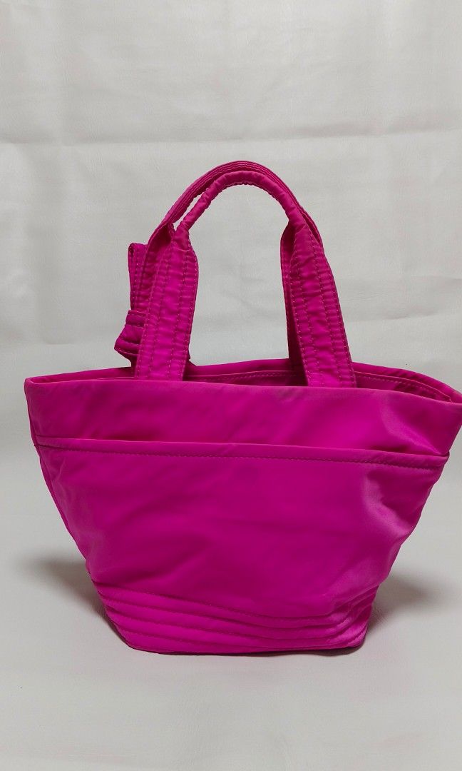 Kate Spade Bow Tote Bag (Category: Luxury Bags & Wallets) located in Baguio. Submitted by PreiLoveMaria (Listing ID 1338094178, Image 3). Description: Kate Spade Bow Tote Bag Lightly Used Features: * Material: nylon * Size: medium * Measurements (L x H x W): 8" x 9" x 7.5" * Silvers-tone hardware * Magnetic snap closure * Fabric lining inside * Inside zipper and open pockets Kindly check the Detailed photos Shipping via J&T only No COD and COP It