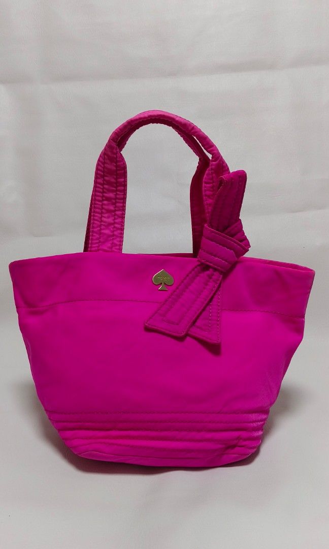 Kate Spade Bow Tote Bag (Category: Luxury Bags & Wallets) located in Baguio. Submitted by PreiLoveMaria (Listing ID 1338094178, Image 2). Description: Kate Spade Bow Tote Bag Lightly Used Features: * Material: nylon * Size: medium * Measurements (L x H x W): 8" x 9" x 7.5" * Silvers-tone hardware * Magnetic snap closure * Fabric lining inside * Inside zipper and open pockets Kindly check the Detailed photos Shipping via J&T only No COD and COP It