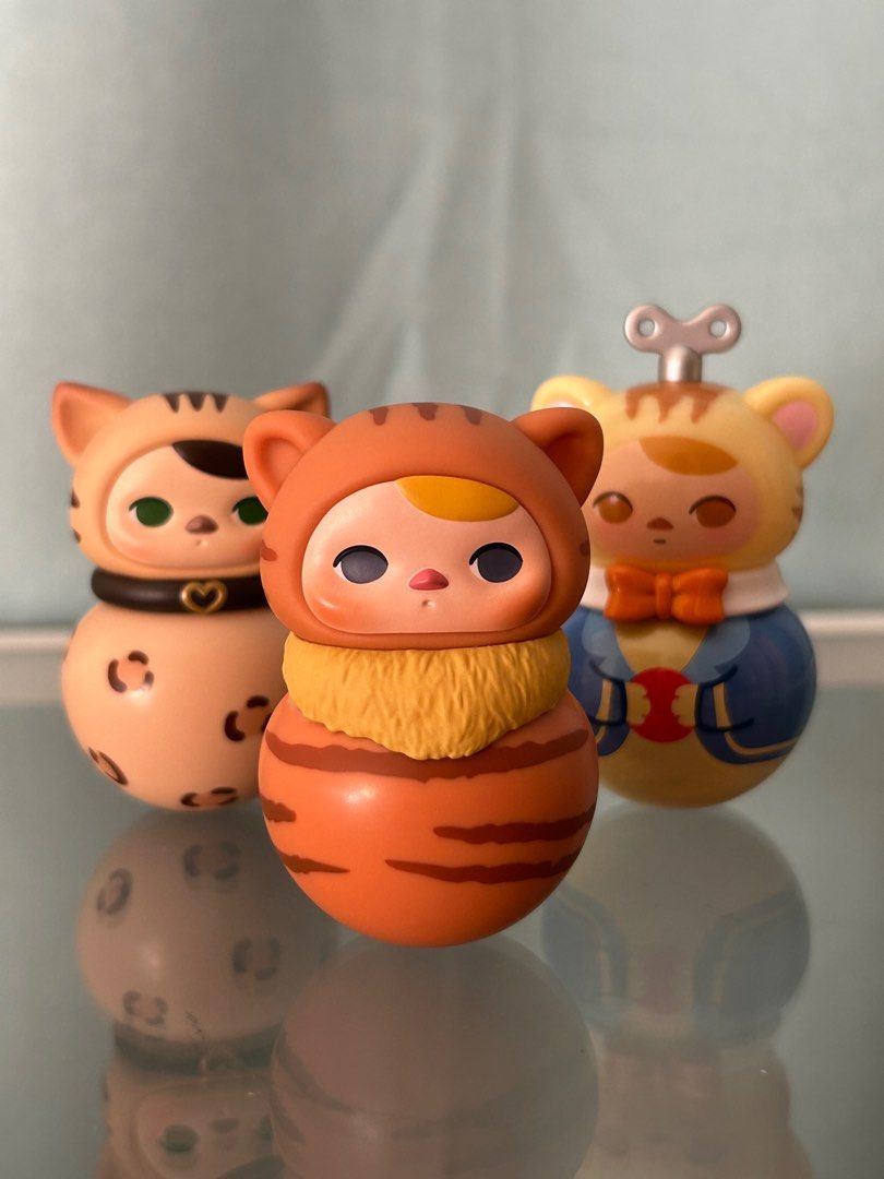 Pucky Roly Poly Kitty (Category: Designer & Blind Box Toys) located in Quezon City. Submitted by defkey (Listing ID 1327955908, Image 3). Description: Complete with box card foil Bengal Red Tabby Windup MOP: BPI, Maya, Gcash MOD: SDD, J&T, LBC.